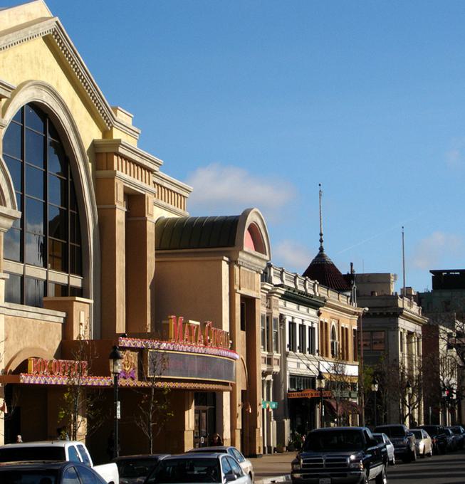 Street view of Salinas Maya Cinemas with cars parked in front