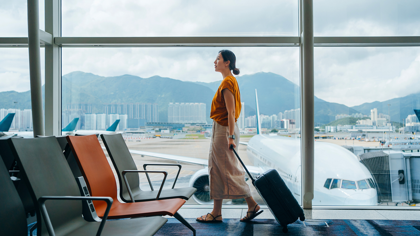 woman walking with suitcase