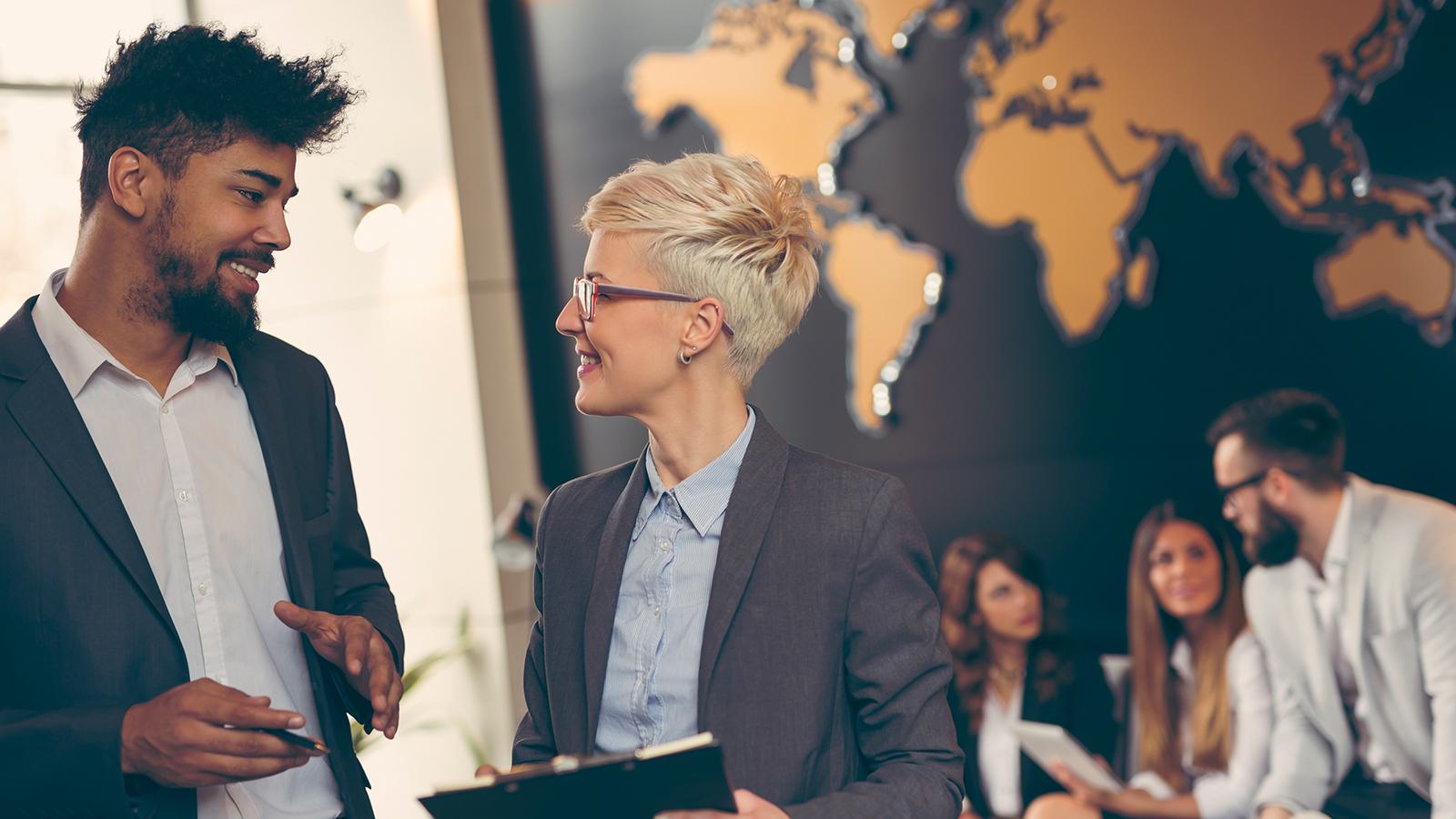man talking with female colleague