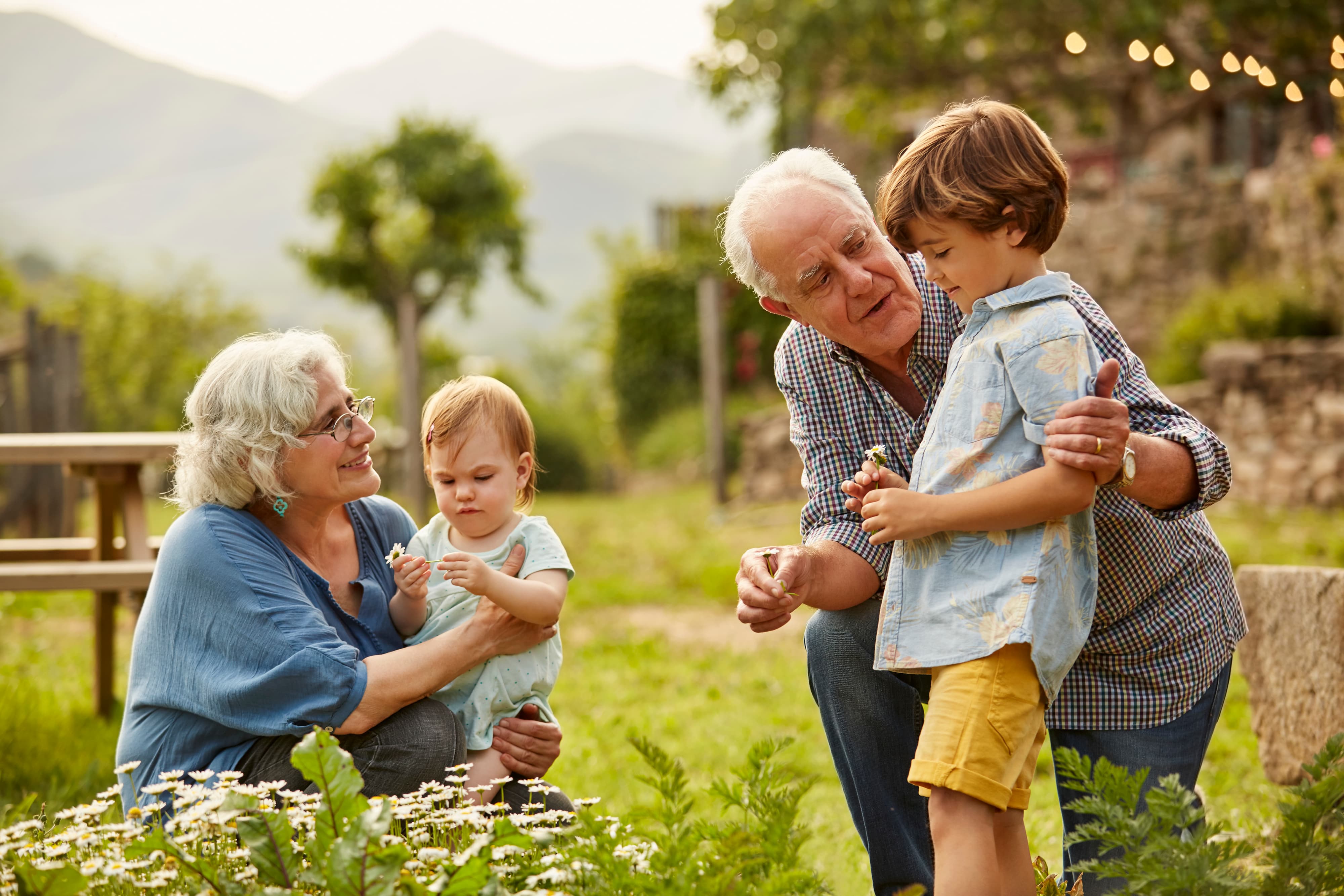 grandparents with grandchildren in garden