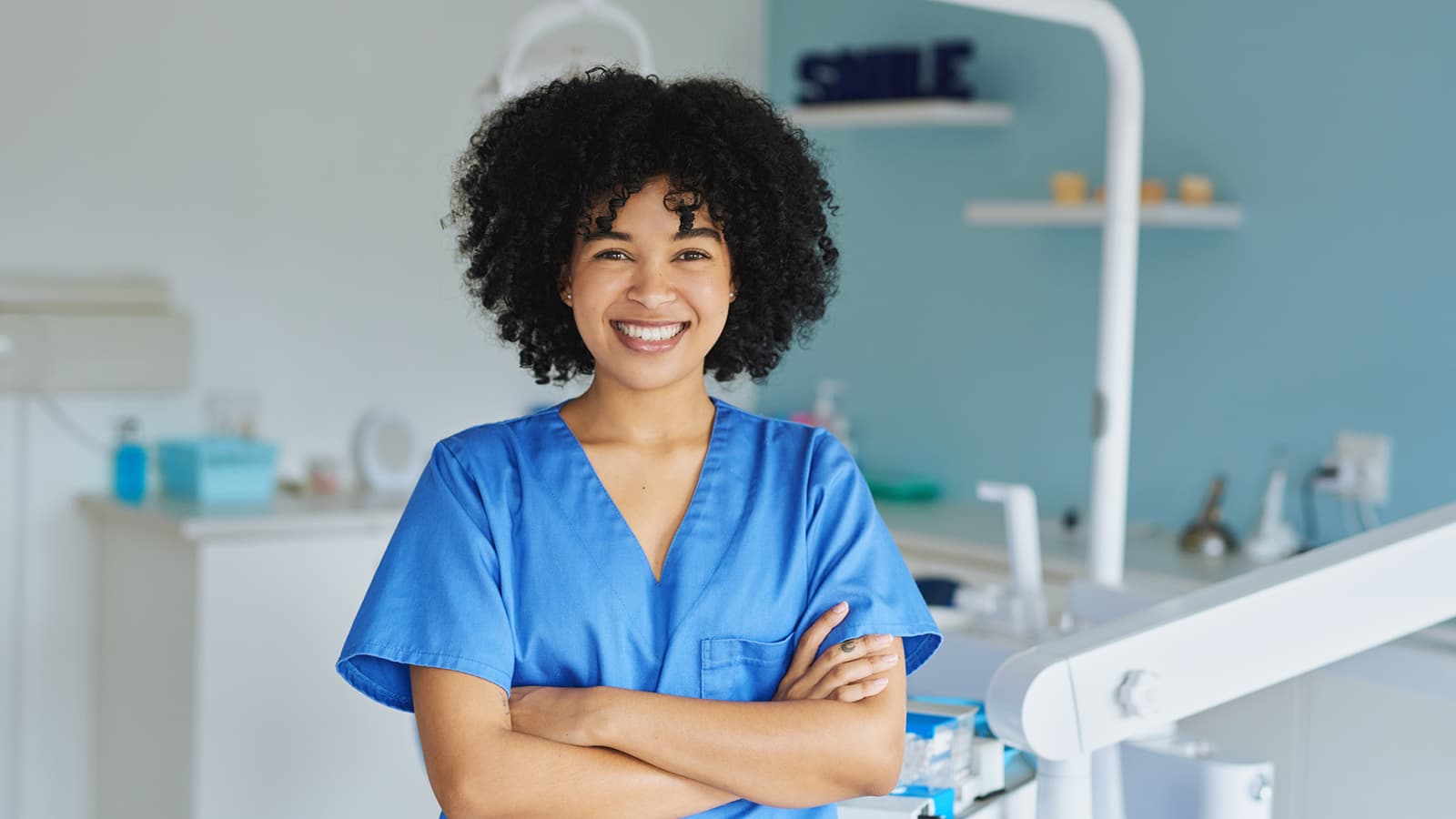young woman working in a dentist’s office